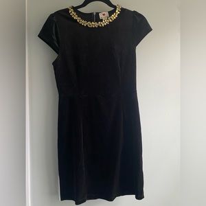 Just a simple black dress with jewels at the collar. No longer fit.
